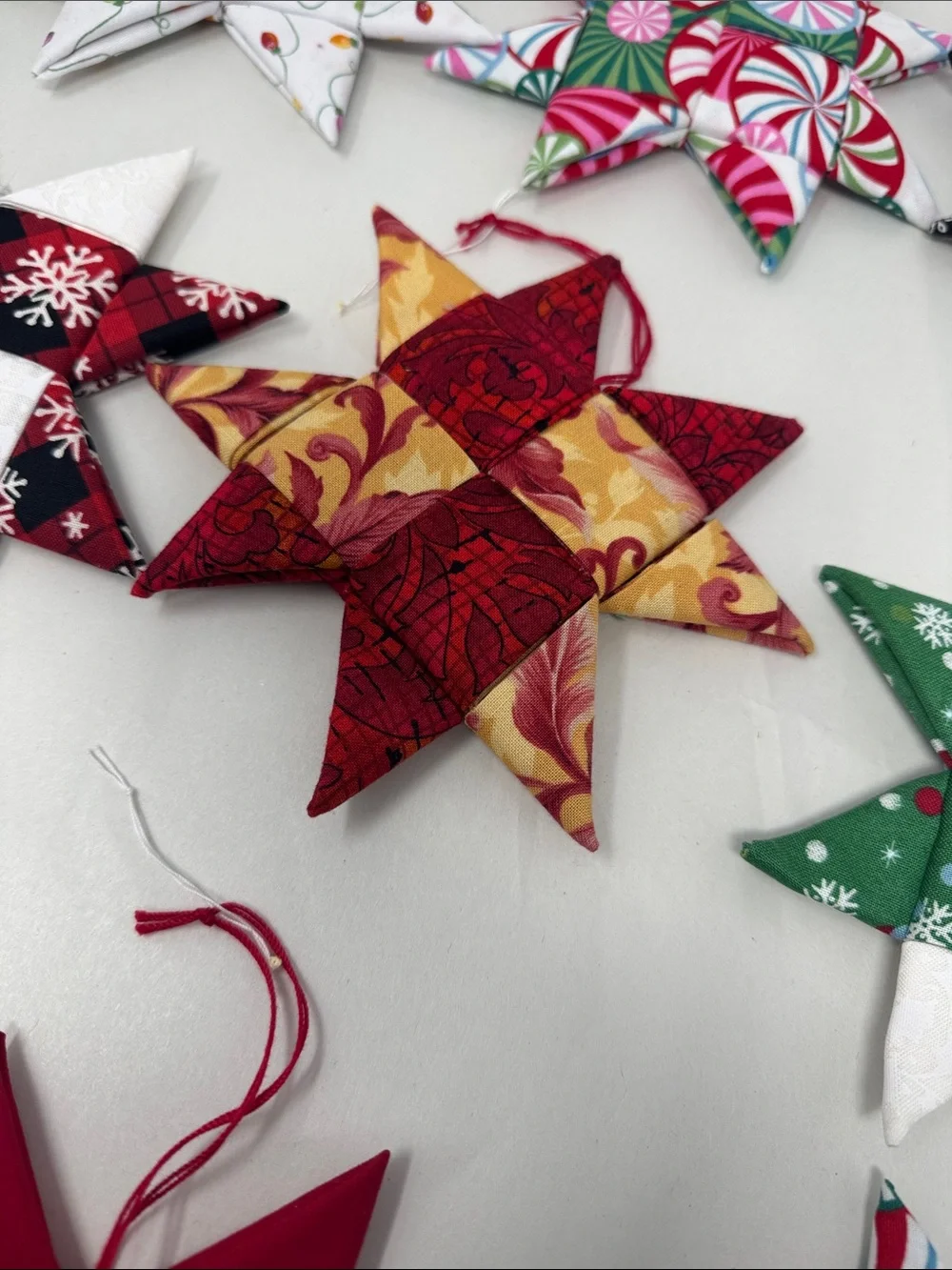 HANDMADE FOLDED FABRIC FOLDED STARS CHRISTMAS ORNAMENTS QUILT LOT OF 11 BOHO
